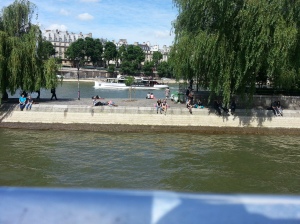 couples relaxing along river seine